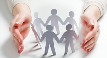 Protecting Board Members from Claims Paper people surrounded by hands in gesture of protection. Concept of insurance, social protection and support.