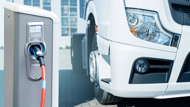 Electric vehicles charging station on a background of a truck. Concept