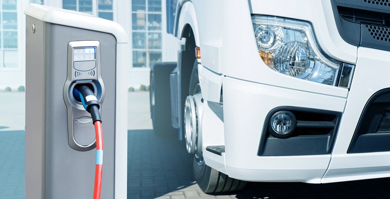 Electric vehicles charging station on a background of a truck. Concept