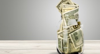 Co-ops Excluded From Rental Regulations, Finally Glass jar for money on background