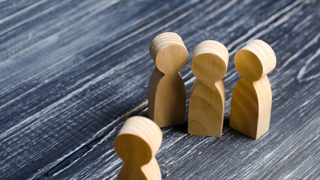 Three people meet one. Three people are aggressively attuned to one. People conduct an interview and a meeting. The concept of attack, threats, encounters, education. Businessmen stand in a group of three.