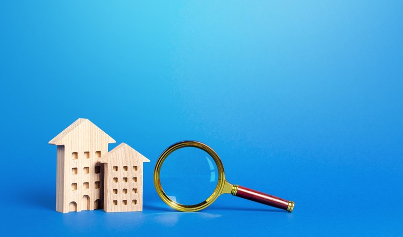 Residential buildings and magnifying glass. Search for real estate to buy. Long-term and short-term rental of apartments and housing. Realtor services. Important things when choosing a property.