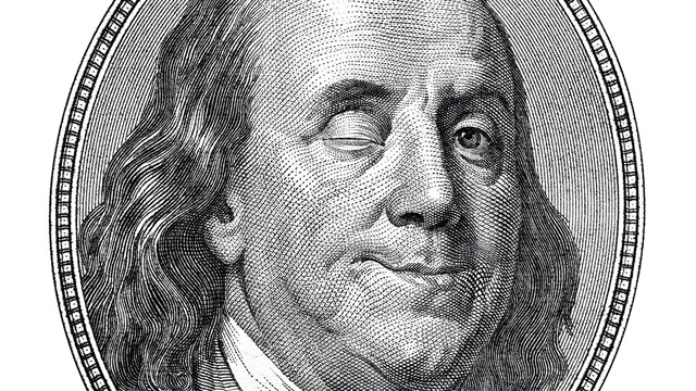 Benjamin Franklin blinking and smiling at you isolated on white