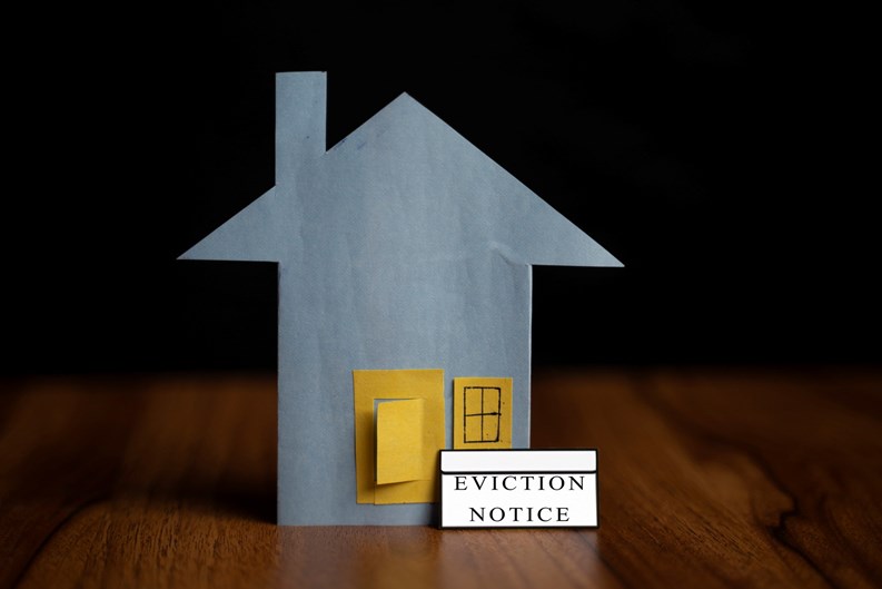 eviction notice sticker IN front of door - concept showing of tenant foreclosure or rent pending on black background