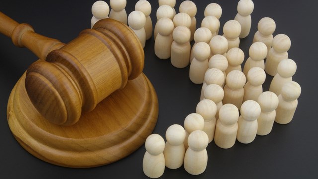 Court and civil law concept. Crowd of people and judge gavel.