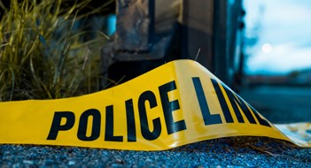 Atlanta Condo Manager Killed by ‘Disgruntled’ Resident Barricade police tape on the ground at a shooting crime scene