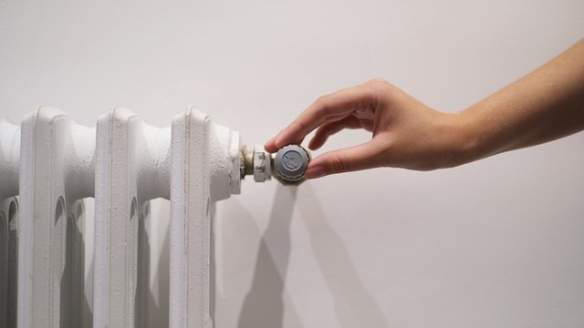 white radiator on a light wall in the room