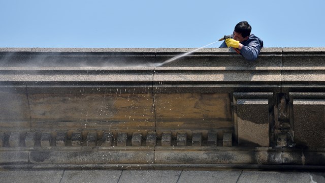 Shanghai, China - March 26: Exterior cleaning and building cleaning with high pressure water jet on March 26, 2016 in Shanghai, China. Shanghai is the largest Chinese city by population.