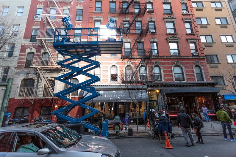 New York City, United States - March 3, 2016: Cinema lights illuminate a film set on a small street near Chinatown