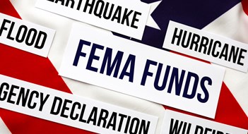Proposed Bill Would Extend FEMA Aid to Condos, Co-ops, & HOAs Logo FEMA with United State of America flag, Federal Emergency Management Agency Government Management