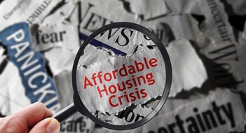 Executive Council for Housing Affordability Urges Congress to Act Affordable Housing Crisis newspaper headline and magnifying glass
