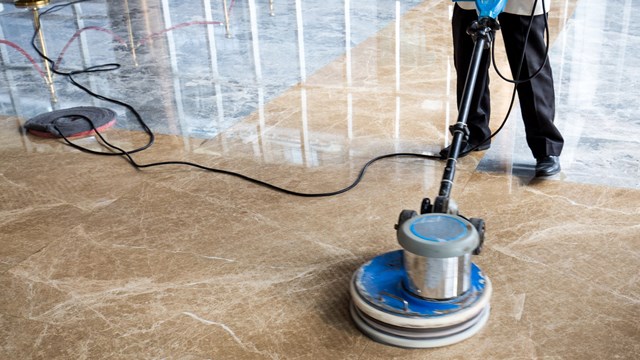 people polishes floor indoors