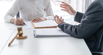 Responding to Litigation Lawyer Legal counsel presents to the client a signed contract with gavel and legal law. justice and lawyer Business partnership meeting