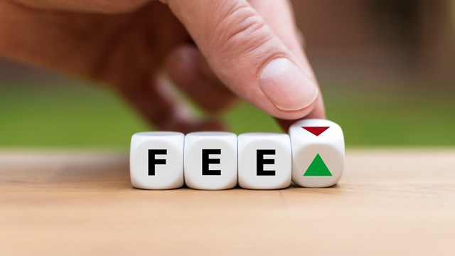 Symbol for increasing or decreasing fees. Hand turns a dice and changes the direction of an arrow. Dice form the word "FEE".
