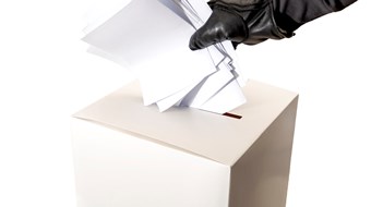 Q&A: Contesting an Election Electoral fraud and hacked elections concept with a hand wearing a leather glove and stuffing a ballot box isolated on white background with copy space and a clipping path cut out