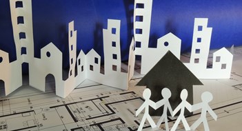 A Look at the Market real estate concept made of cutted paper over a printed project
