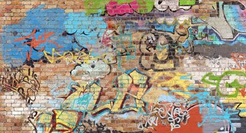 Removing Graffiti & Vandalism Graffiti on brick wall, composite of various images, layered and altered digitally so as to be non-identifiable.