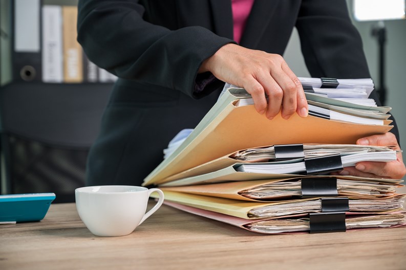 Close up Office employee working with documents at business desk in a business office