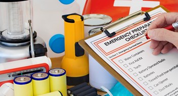 Emergency Preparedness Ready for disaster - checking off the items on the emergency  preparedness form