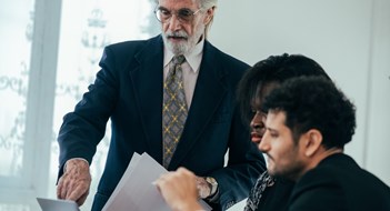 Helping the New Kids on the Block Teamwork meetings, tablets, and business people in the office workplace. Collaboration, technology and workers, men or employees with touchscreen planning sales, company research.